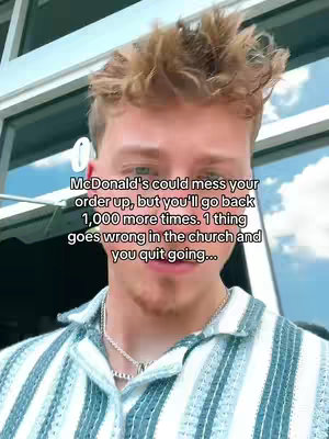 A selfie-style shot featuring a young man with short, styled, light-brown hair. He's wearing a striped, open-collared shirt and a silver necklace. The background is out of focus, showing glimpses of a building exterior, suggesting an outdoor setting. Text overlayed on the image says 'McDonald's could mess your order up, but you'll go back 1,000 more times. 1 thing goes wrong in the church and you quit going...'.