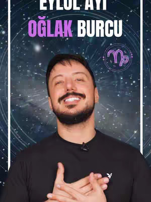 The cover image features a man with a beard and mustache, smiling and looking directly at the camera. He is wearing a black t-shirt. Above him, there is text in a vibrant pink color, and a circular graphic containing a zodiac symbol. The background is a dark blue with a starfield effect, creating a cosmic or astrological theme.