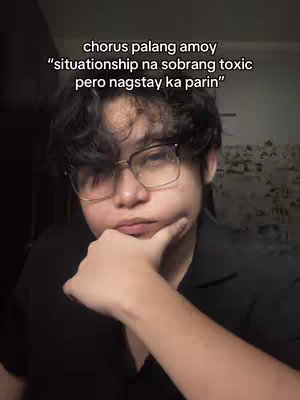 The image is a close-up of a person posing with their hand under their chin. The person has dark, wavy hair, glasses, and appears to be deep in thought. Overlayed at the top is text in a white, sans-serif font.