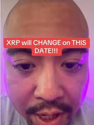 The cover image is a close-up of a person's face. The person is balding and has dark hair around the sides and a mustache and goatee. They are looking at the camera, with the phrase "XRP will CHANGE on THIS DATE!!!" in large, red, rectangular text above their eyes. The background is a gradient of pink and purple.