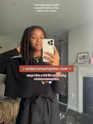 A selfie-style image with a young woman holding a phone to capture the image. She's centered with her hair framing her face, and text overlays at the bottom. The background looks like a well-lit room with some decor but primarily shows her reflection. The overall tone is casual and aims to be relatable, focusing primarily on the person in the image.