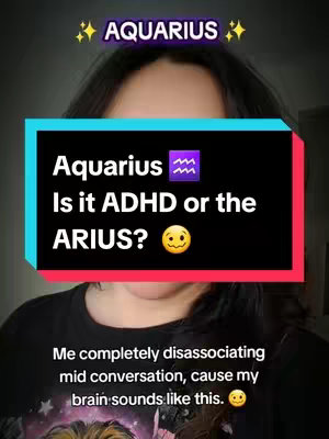 A selfie-style image featuring a person from the chest up. The person has dark hair and is wearing a dark shirt. Overlayed on the image is a large rectangular text box containing the text 'Aquarius Is it ADHD or the ARIUS?' with the Aquarius symbol and a yellow smiley face. The words 'AQUARIUS' is at the top of the image with a sparkle icon on both sides. Below the text box, a second text line reads, 'Me completely disassociating mid conversation, cause my brain sounds like this.'