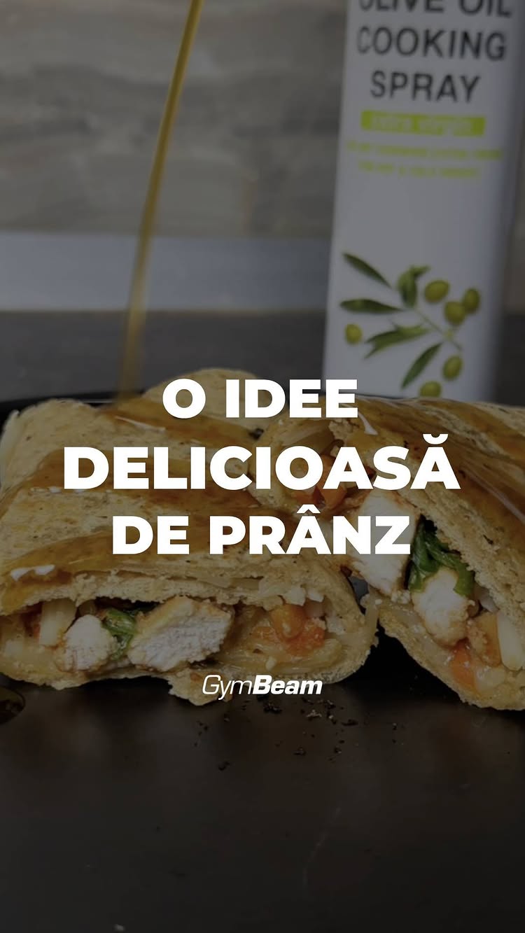 The image features a halved burrito, revealing its filling of chicken and vegetables, with oil being drizzled over it. The text overlay suggests a lunch idea, and the GymBeam logo is visible at the bottom.