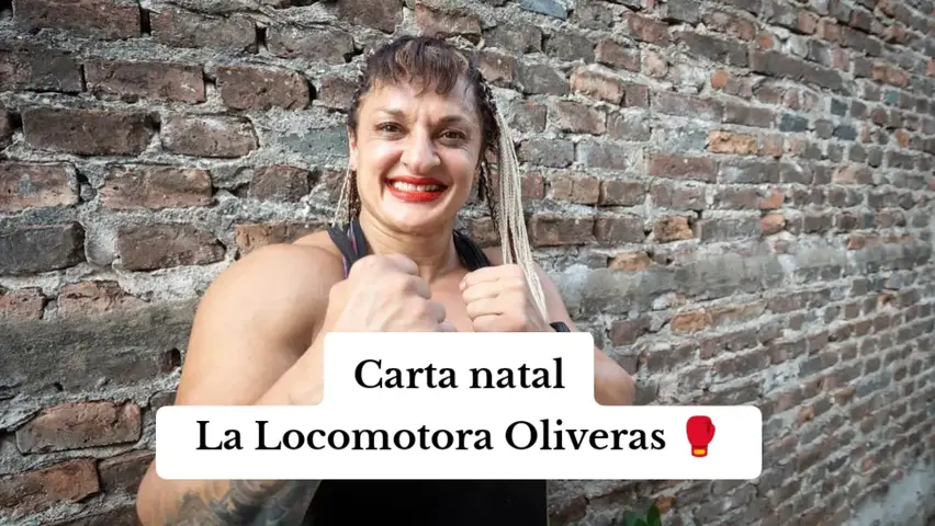 The cover image features a woman posing in front of a brick wall. She is smiling and has her fists clenched, with an overlay over a white background that says 'Carta natal' and 'La Locomotora Oliveras' with a boxing glove emoji.