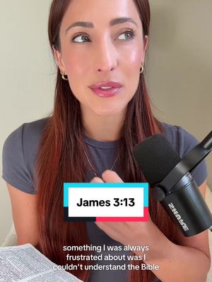 A woman with long auburn hair is speaking to the camera. The frame is filled with her face and upper body, and a microphone sits to her right while a Bible is visible opened in front of her. Text overlay boxes with the words 'James 3:13' are at the bottom.