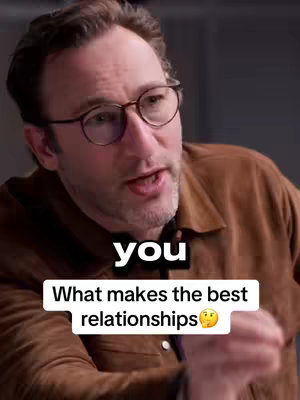 A medium shot features a man speaking with a slightly open mouth, wearing glasses and a brown shirt. Overlaid are two text boxes: one stating 'you' and the other reading 'What makes the best relationships' with an emoji, all against an out-of-focus background.