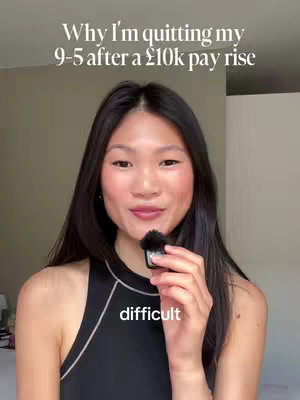A woman with long dark hair is holding a microphone in front of her. Text overlayed reads, "Why I'm quitting my 9-5 after a £10k pay rise". A second text overlay at the bottom of the screen reads "difficult".