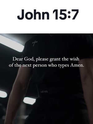 The image is a vertical shot featuring text overlays on a blurred background of a person. The top text says 'John 15:7' in a bold, white font. Beneath it, a quote is displayed in a clear, easy-to-read font: 'Dear God, please grant the wish of the next person who types Amen.' The text fills a significant portion of the frame. The background is blurred, with visible lighting, and the person in the background is wearing a dark-colored shirt with a cross visible.