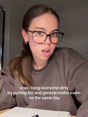 A young woman with glasses looks at the camera in a close-up shot, featuring a text overlay.