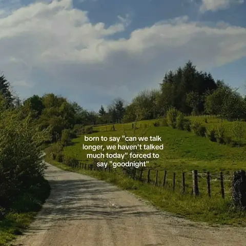 A scenic view of a countryside road with green fields and trees under a blue sky with clouds. Text overlayed on the image.