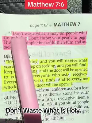 Image of an open book with highlighted text in yellow and pink, and a pink pen with a black tip on the page. The text is from Matthew 7:6, emphasizing the verses about not casting pearls before swine.