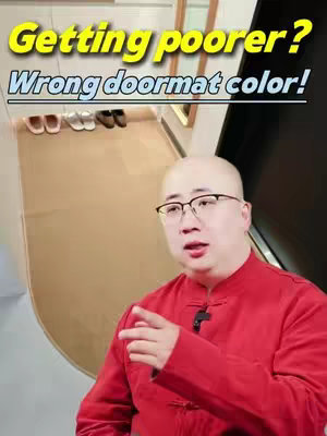 A bald man wearing glasses and a red shirt is pointing at the camera. Behind him is a door with a long tan doormat and some shoes, suggesting a home environment. Text overlays highlight the video's topic.