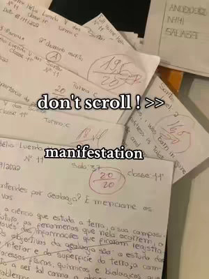 The image shows several sheets of lined paper, possibly exam papers, with handwritten text and grades. The papers are stacked and slightly overlapping, creating a sense of depth. The topmost papers have text overlaying them in bold white font. The overall composition suggests an academic or educational theme.