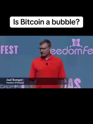 The cover image shows a man speaking on a stage at a conference. The speaker is wearing glasses and a red polo shirt and is positioned in the center of the frame. Behind him is a blue background with the words FEST, and freedomFe at the top.