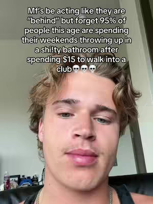 A selfie-style shot featuring a young man against a neutral background. He has short, light-brown hair and is looking slightly off-camera. Overlayed text is at the top.