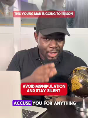 A man with a serious expression addresses the camera. Text overlays appear in colored boxes. The background shows a blurred interior setting with a globe on a stand.