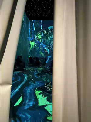 An artistic interior, resembling a Van Gogh painting, is framed by open curtains. The room features swirling brushstrokes in shades of blue, green and yellow, forming dreamlike landscapes and reflective surfaces. The ceiling is dark, sprinkled with lights, while the right curtain is fully open, and the left one is partially so.