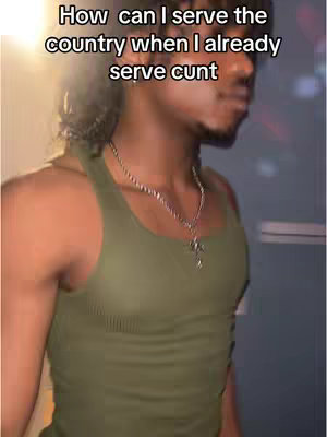 The cover image shows a person of color, facing slightly right, with a snippet of overlayed text to the top. The person is wearing a green tank top and a silver chain hangs from his neck. The background is dark. The image is well-lit; the person is the main focus.