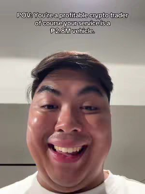 The cover image features a close-up shot of a man smiling broadly with his tongue slightly visible. The background is a plain, light-colored wall. Text overlay at the top of the image reads, "POV: You're a profitable crypto trader of course your service is a P2.8M vehicle."