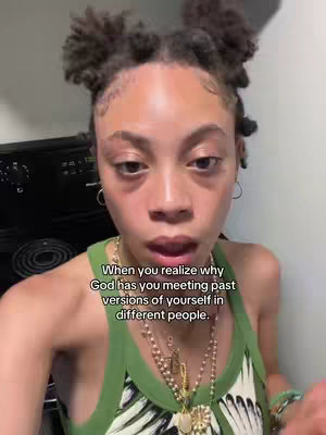 The cover image shows a close-up of a person with dark hair styled in small buns on top of their head. They are wearing a green spaghetti-strap top and multiple gold necklaces. Text overlayed onto the image reads, "When you realize why God has you meeting past versions of yourself in different people."