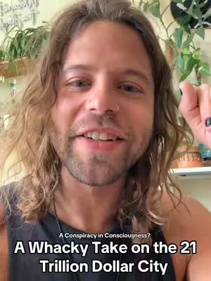 A man with long, wavy brown hair smiles directly at the camera. He appears to be in a domestic setting, with green plants in the background. Text overlays at the bottom of the image read, 'A Conspiracy in Consciousness?' Above, and 'A Whacky Take on the 21 Trillion Dollar City' on the bottom.