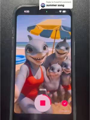 The cover image is a selfie-style shot on a phone screen displaying a family of cartoon sharks posing on a beach. The family consists of a mother shark in a red swimsuit, a father shark, and two smaller shark children. They are smiling with friendly expressions. The background features a beach scene with blue ocean and sky, a sandy shore, and a yellow and blue beach umbrella. The phone's interface has time, a video-in-progress timer, and a red record button.