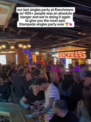 An interior shot of a crowded bar with a stage. The text overlay is white and outlines the details.