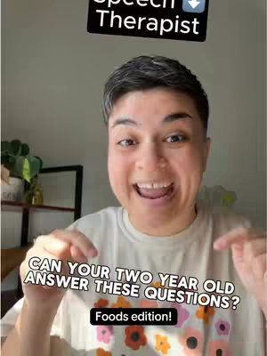A selfie-style shot featuring a light-skinned person with short, dark hair, smiling broadly with their mouth open. They are wearing a light-colored t-shirt with a colorful, possibly floral, pattern. The background is slightly out of focus, suggesting an indoor setting. Overlay text in the image presents a question written in a casual style along with a bottom bar to describe the content.