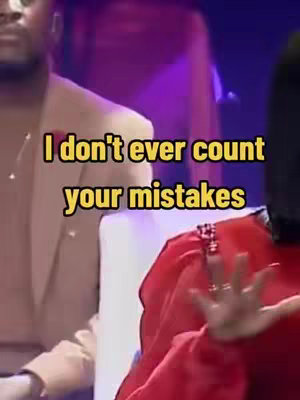The image shows three people in a likely event or performance setting. The foreground features a person in a red outfit, their arm raised as if gesturing. Beside them, a person in a tan suit jacket is visible. The background seems to be a stage or performance space, with purple lighting. The primary focus appears to be on the text overlayed on top.