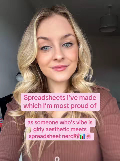 A woman with blonde hair and light makeup smiles at the camera. Overlayed text in pink boxes describes her and the video's content. The background is a neutral wall with a visible light fixture.