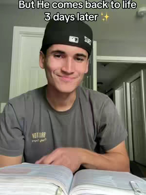 A young man in a gray t-shirt and a black cap is smiling and looking down at a book, seemingly in a room. Text overlays the top part of the image.