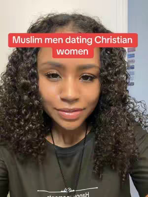 A close-up of a young woman with curly dark hair, looking directly at the camera with a slight smile. A red rectangular text overlay at the top of the frame reads "Muslim men dating Christian women." She is wearing a black shirt, and a dark necklace is visible. The background is a simple white wall.