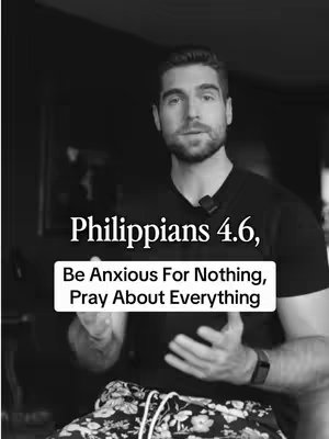 A grayscale image shows a man in a dark setting, facing the camera. Above his head is text that says, "Philippians 4.6, Be Anxious For Nothing, Pray About Everything" in white, and it is set on a white background. The man holds his hands out.