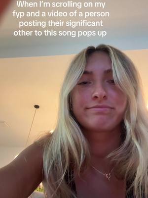 A young woman with long blonde hair and a slightly amused expression is positioned in front of a soft, out-of-focus beige background. She's wearing a delicate necklace and a dark top, her expression and the overlayed text suggest a relatable, observational theme related to social media encounters.