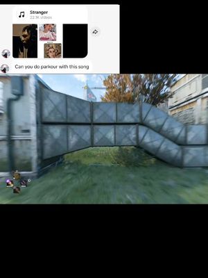 The cover image shows a section of what appears to be a video game environment. A metal structure, likely part of a building or a bridge, dominates the central portion of the image. The structure has multiple horizontal and diagonal supports. The ground beneath the structure appears grassy. Parts of a user interface that includes a song selection menu are visible in the top left corner. A player is shown at the bottom left corner with health bar visible. The video appears fast moving
