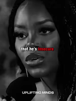 A close-up, grayscale image of a Black woman with long hair and braids speaking into a microphone. Text overlayed on the image reads "that he's insecure," with "insecure" in red. The bottom of the image contains the text "UPLIFTING MINDS."