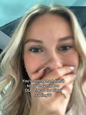 A selfie of a woman, with blonde hair, covering her mouth with her hand and smiling. The text overlay is present at the bottom.