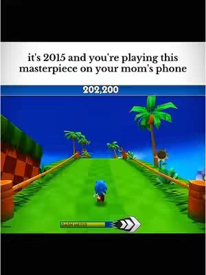 The image is a vertical screen capture of a mobile game, featuring a 3D rendered scene from the game, Sonic Dash. The game is set on a green pathway, with Sonic the Hedgehog running toward the viewer. In the scene, there's a blue sky, green palm trees and red-and-brown checkered walls on the side. The game's score and a dash meter are displayed at the top and bottom, respectively. The visual style is bright and colorful, indicative of a mobile game aesthetic.