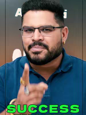 A man with glasses points towards the viewer, text overlaid promoting success.