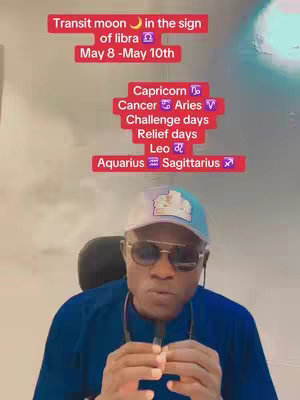 A man wearing sunglasses and a hat is centered in the frame, with text overlays at the top detailing astrological transit information. The background is softly blurred, featuring a partial view of a large planet or moon.