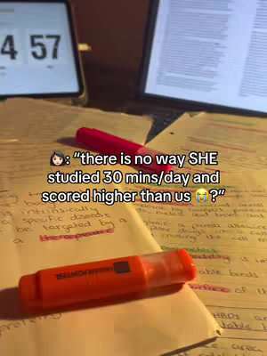 The image shows papers with handwritten notes and highlighted text, a red highlighter, and a digital timer showing the time 4:57 on the left side. On top of the papers, the hook text is overlaid.