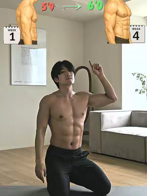 A shirtless man kneels on a mat in a room with a minimalist design, sunlight illuminating his muscular physique. He points upwards with one arm, while in the background images of how the creator’s body changes are displayed, from 5'9 to 6'0 to show before and after of his body