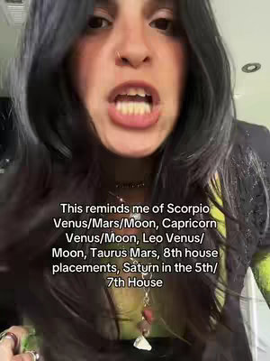 A selfie-style image featuring a woman with dark hair and an intense expression, possibly yelling. She's wearing a black top with a green undershirt, and jewelry. The text overlay lists astrological placements.