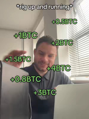 A man is seated in an office setting with a partly visible window and blinds. The man is looking down and to the right, smiling slightly. Overlayed are green text elements representing Bitcoin gains.