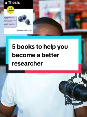 The cover image features a man's face partially visible behind a rectangular graphic with text overlaying a book cover. The graphic contains the text "5 books to help you become a better researcher". The book cover on the left is titled "a Thesis (3rd edition)" with the author "Rowena Murray". The background is a blurred room with red and orange items.