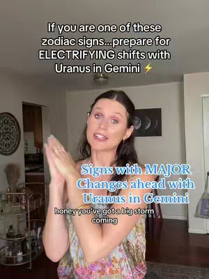 A medium shot shows a woman with light skin and dark hair framed against an indoor background. She's dressed in a patterned top. Text overlays her and includes astrological information.
