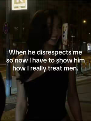 A woman wearing a black top stands on a street at night. The background is blurred, but suggests urban environment. The woman is smiling with text overlayed.