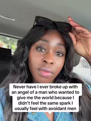 A selfie-style image featuring a woman in a car, with text overlaid on the bottom. She has long, dark, wavy hair, and sunglasses perched on her head. Her expression is serious, with a touch of pensiveness. The background suggests a car interior, and her hand is raised near her forehead. The image is well-lit, focusing on her face and the text overlay.