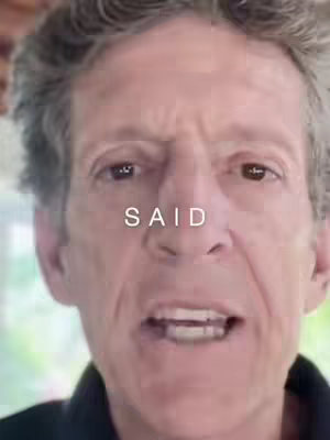 A close-up shot of a middle-aged man with graying hair and a somewhat concerned expression. The word "SAID" is superimposed in white text across the center of the image. The background is softly out of focus, suggesting an interior setting.