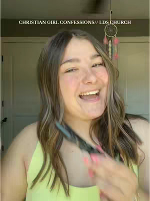 The cover image is a selfie of a young woman with long, wavy, highlighted blonde hair. She is smiling widely with her mouth open, revealing her teeth. Her skin appears to have a light blush, and she is wearing a light yellow or green tank top. She is holding something in her hand that is partially obscuring the view and with a background of a door.
